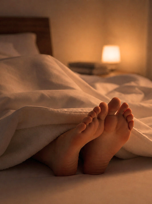 Image of a pair of feet inside CozyLife Foot Warming Bed Sheets