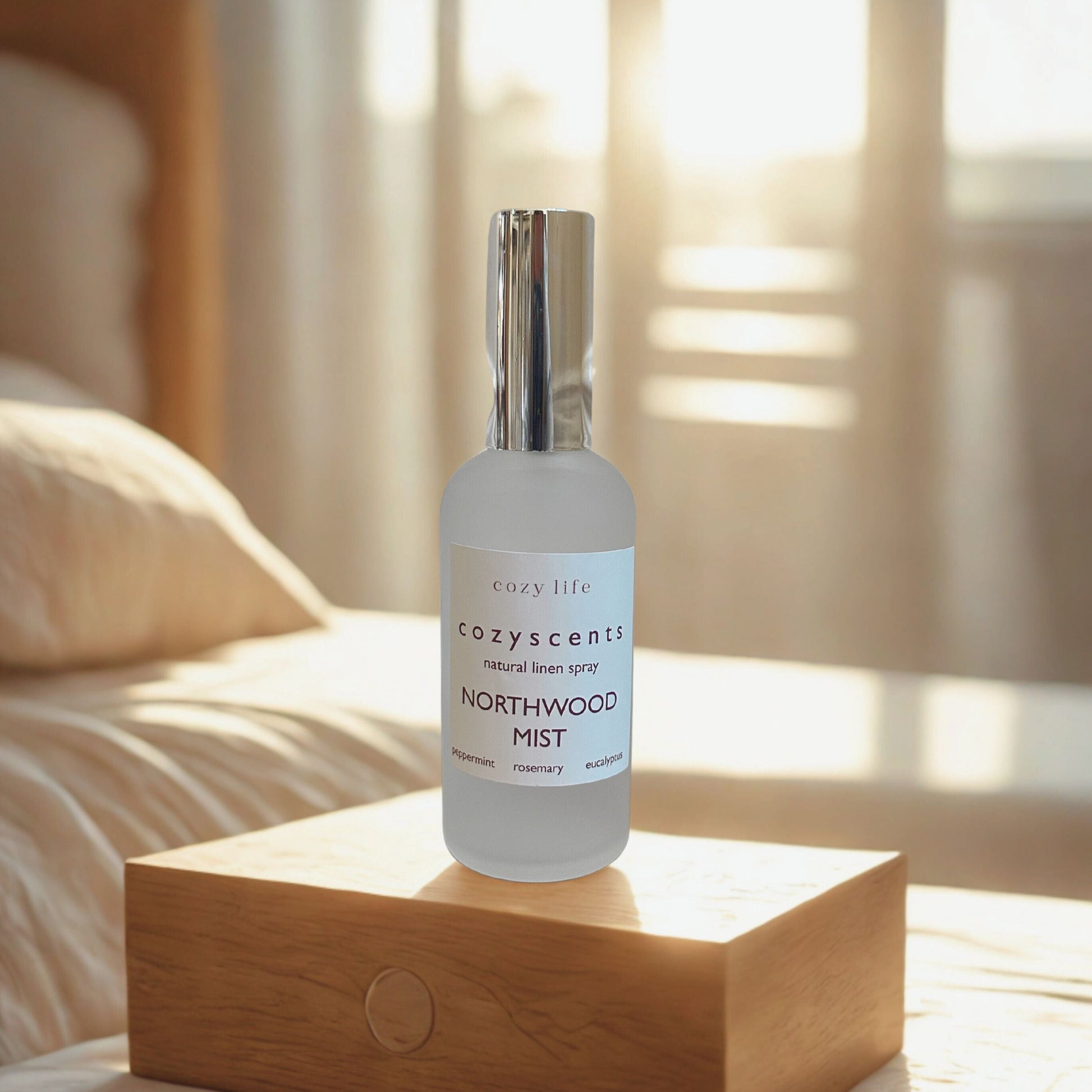 Bottle of 'Northwood Mist' on a wooden stand with a soft, blurred background.